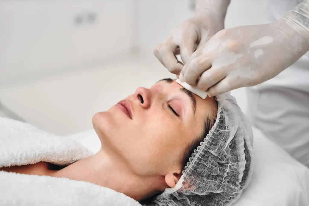 A client enjoys a soothing skin treatment while relaxing at a spa.