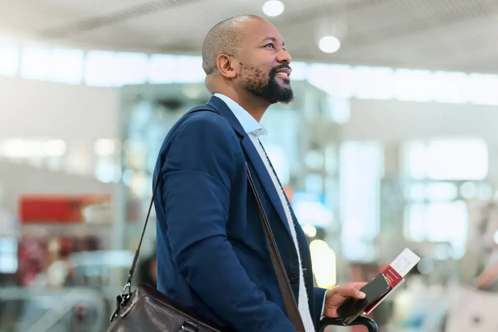 Man holding ticket in airport