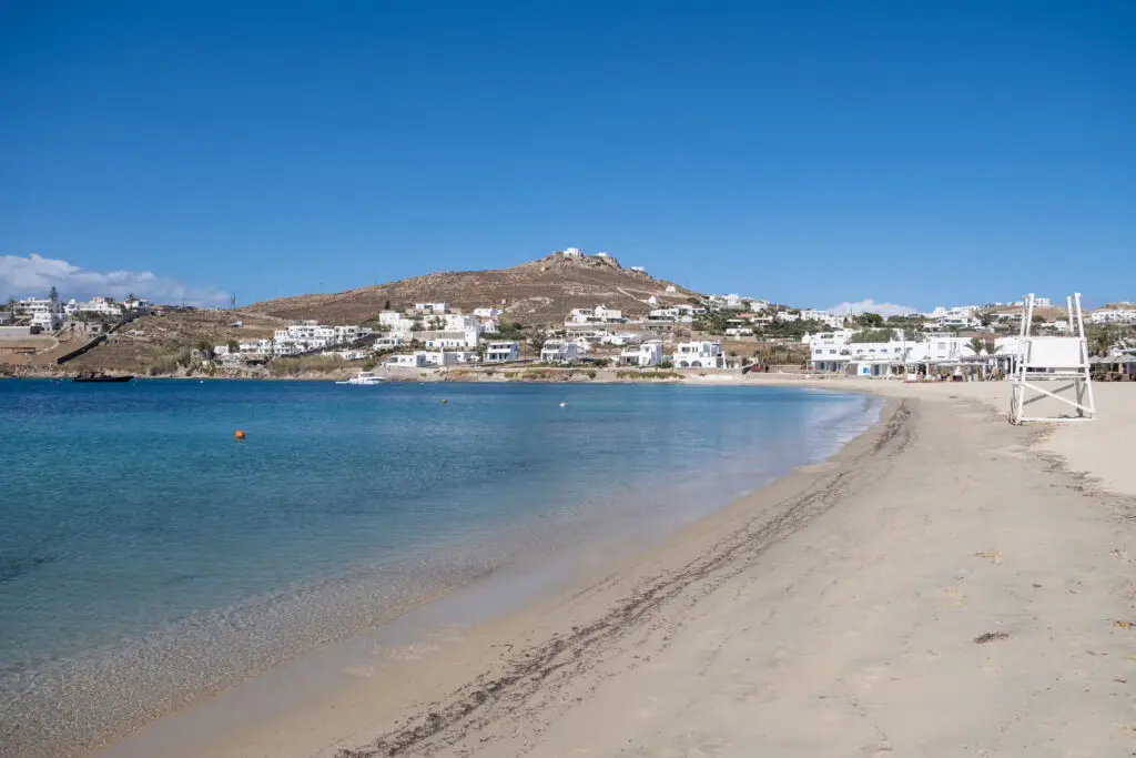 Clear water and sheltered sandy beach at Ornos on Mykonos