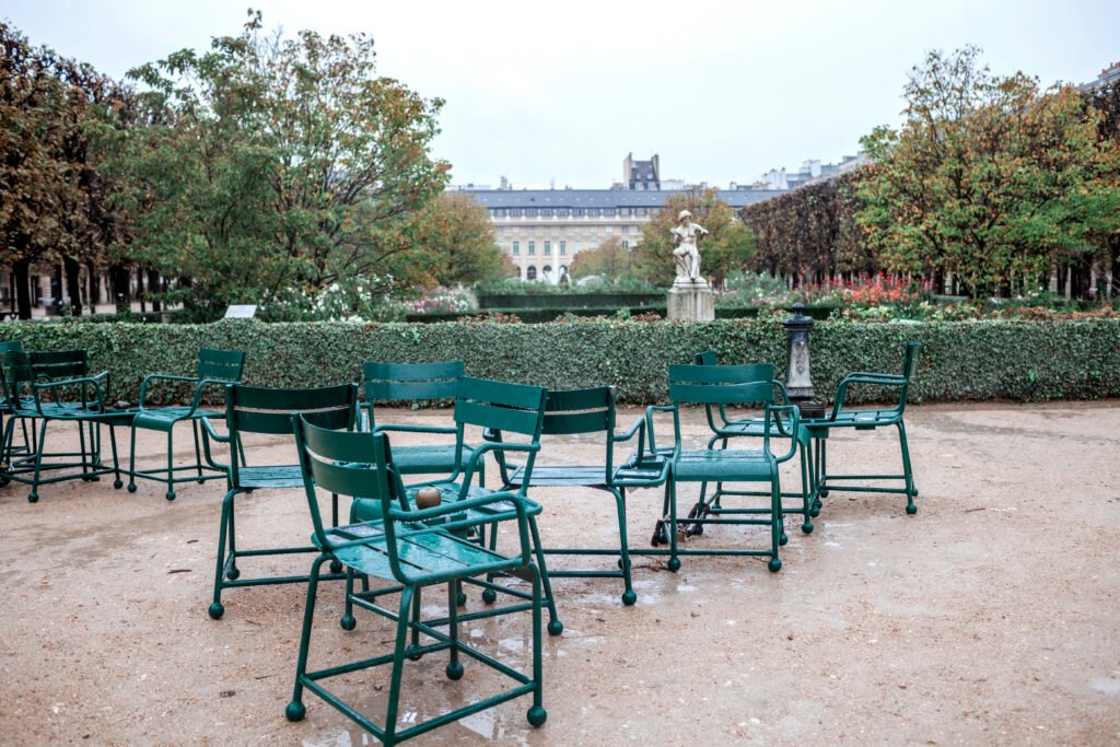 Green chairs and formal planting in the Tuileries Garden in Paris