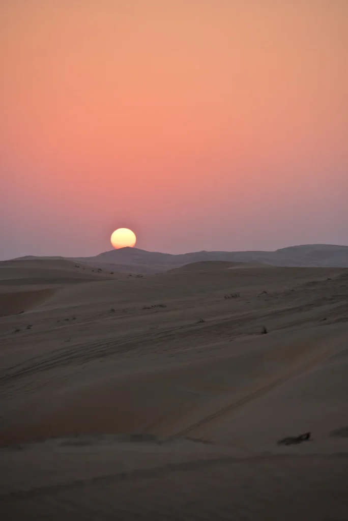 Sunset over quiet dunes in Liwa, United Arab Emirates