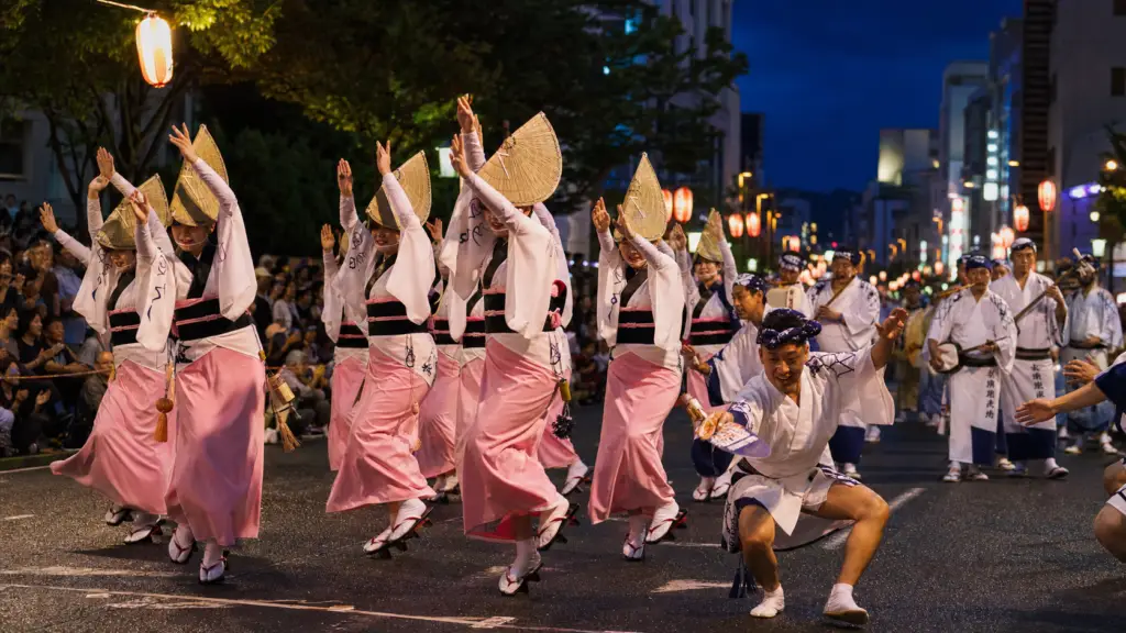 Awa Odori dancers and musicians performing in Tokushima at blue hour
