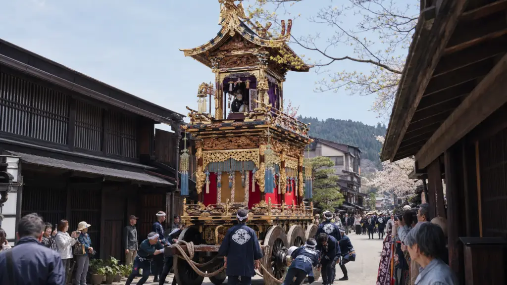 Ornate Takayama festival yatai float passing through a historic Japanese street