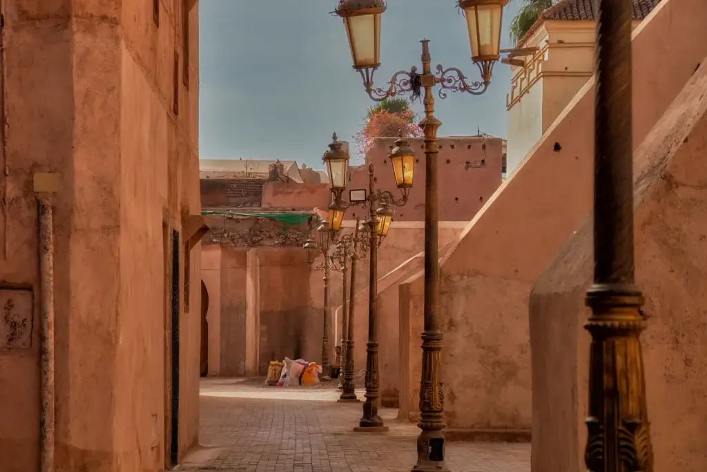 Ochre passage and decorative lamps within Marrakech’s historic city