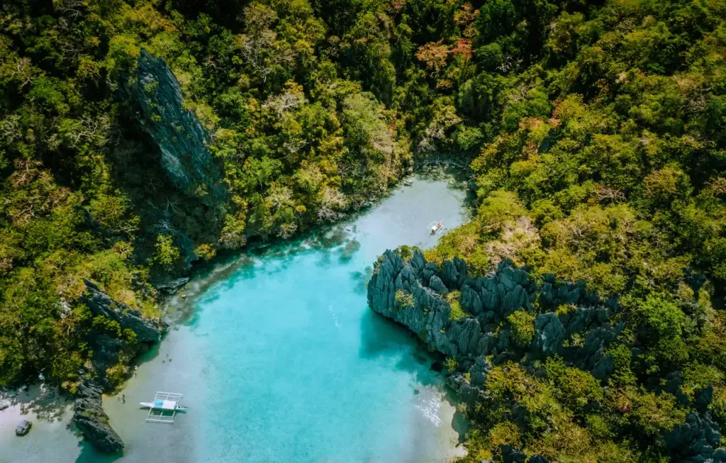 Aerial view of a turquoise limestone lagoon in Palawan, Philippines