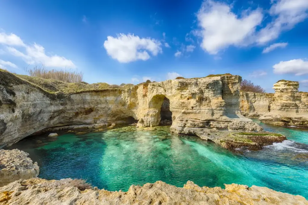 Sea arches and turquoise water at Torre Sant'Andrea on the Salento coast