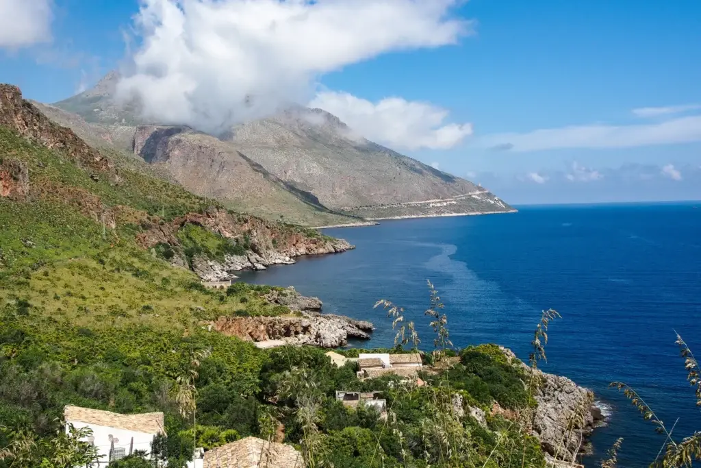 Rocky coastline and blue Mediterranean water at the Zingaro Nature Reserve in Sicily