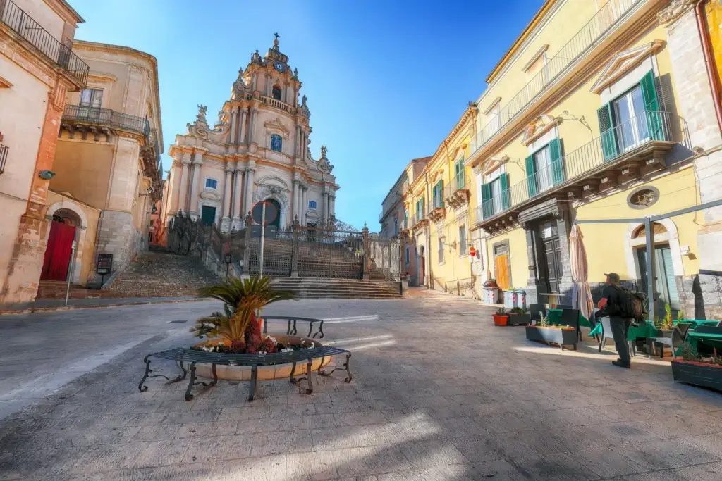 Warm stone Baroque church and square in Modica, Sicily