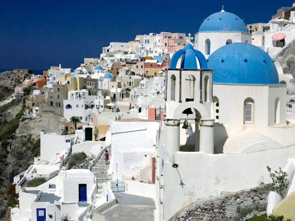 Blue-domed churches and whitewashed buildings in Oia, Santorini