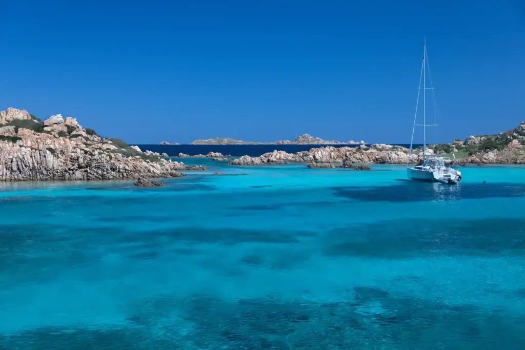 Sailing yacht among granite islands in the La Maddalena Archipelago