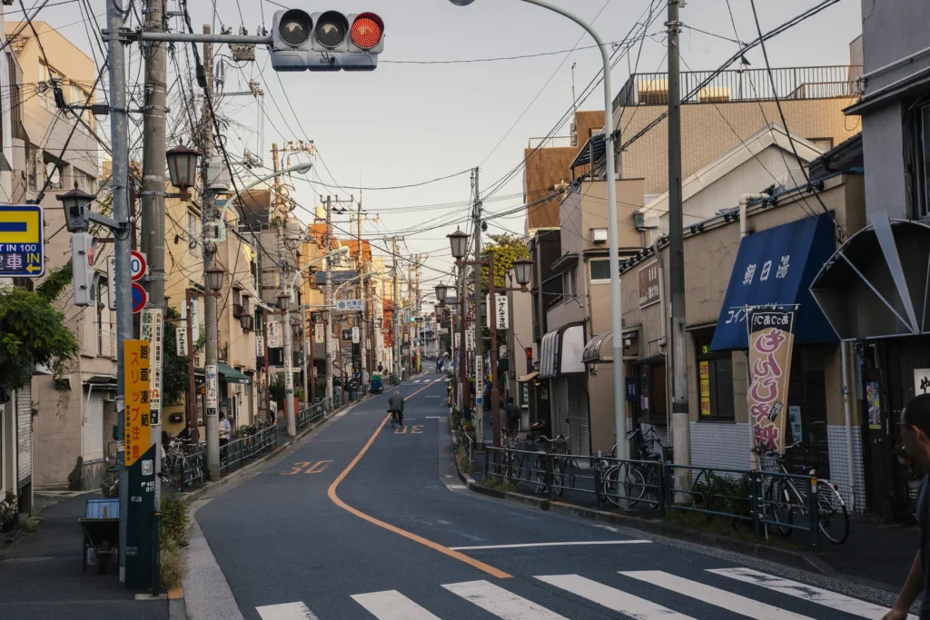 Quiet residential street in Tokyo with bicycles and low-rise buildings