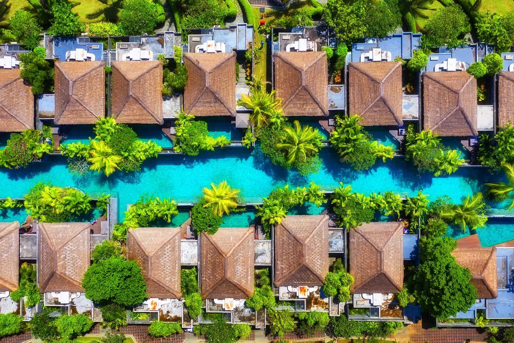 Aerial view of private resort villas and tropical pools