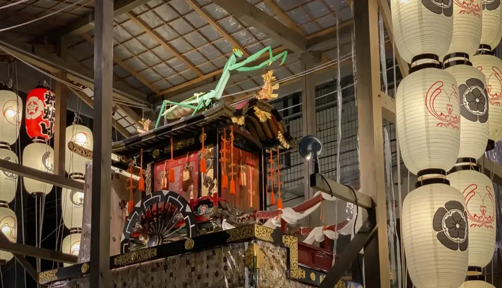 Illuminated yamahoko float and lanterns during Gion Matsuri in Kyoto