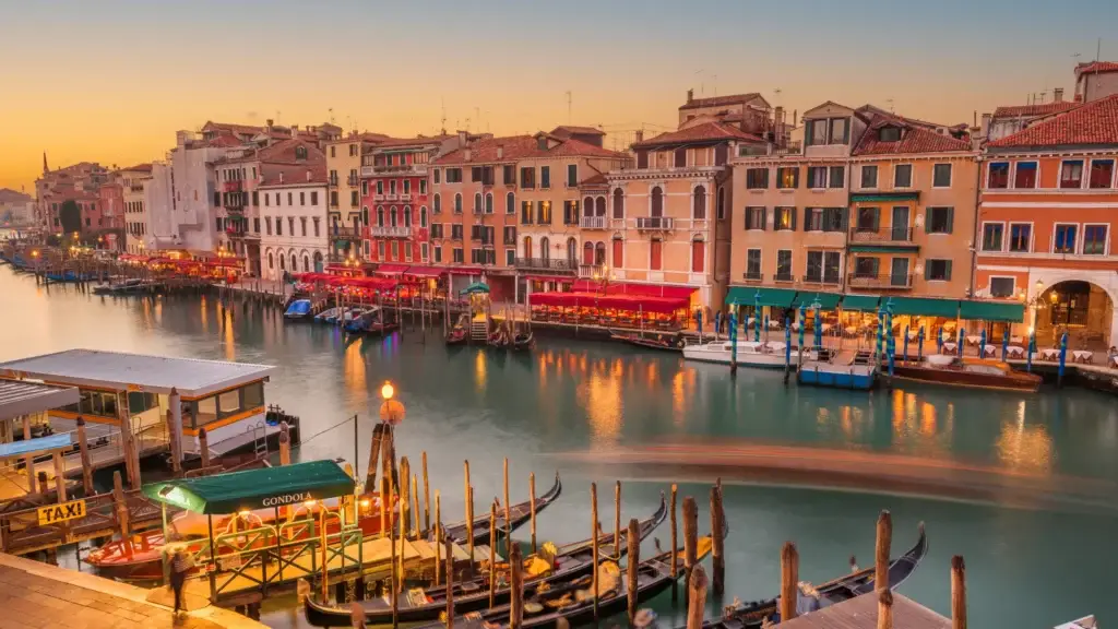 Grand Canal in Venice lined with historic palazzi at dusk