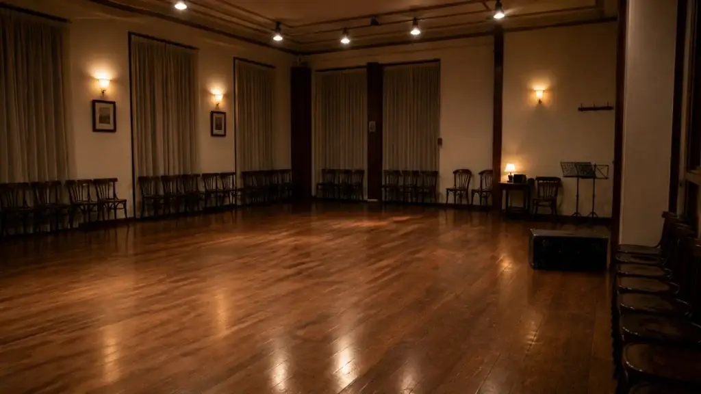 Rights-cleared documentary photograph of a current Buenos Aires neighbourhood milonga or tango lesson in an identified venue