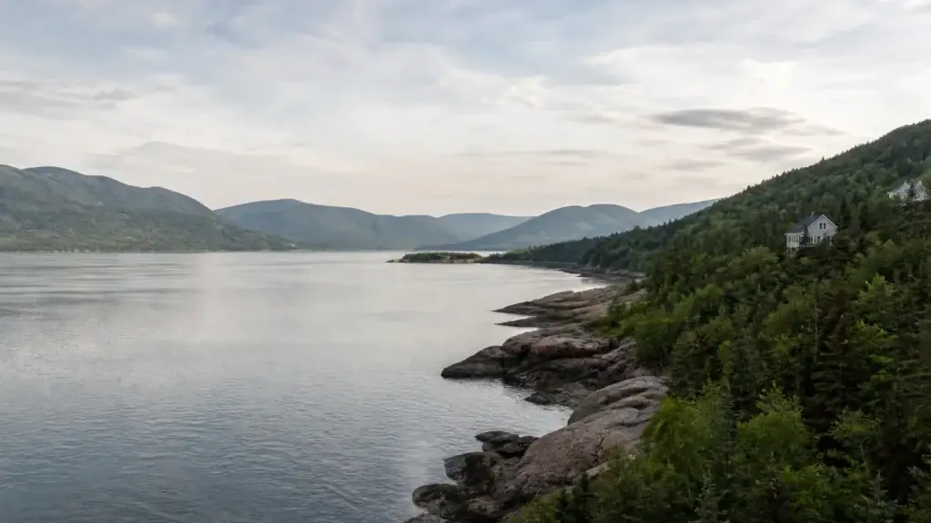 Recognizable Charlevoix landscape with St. Lawrence River, mountains and a documented Baie-Saint-Paul or La Malbaie context