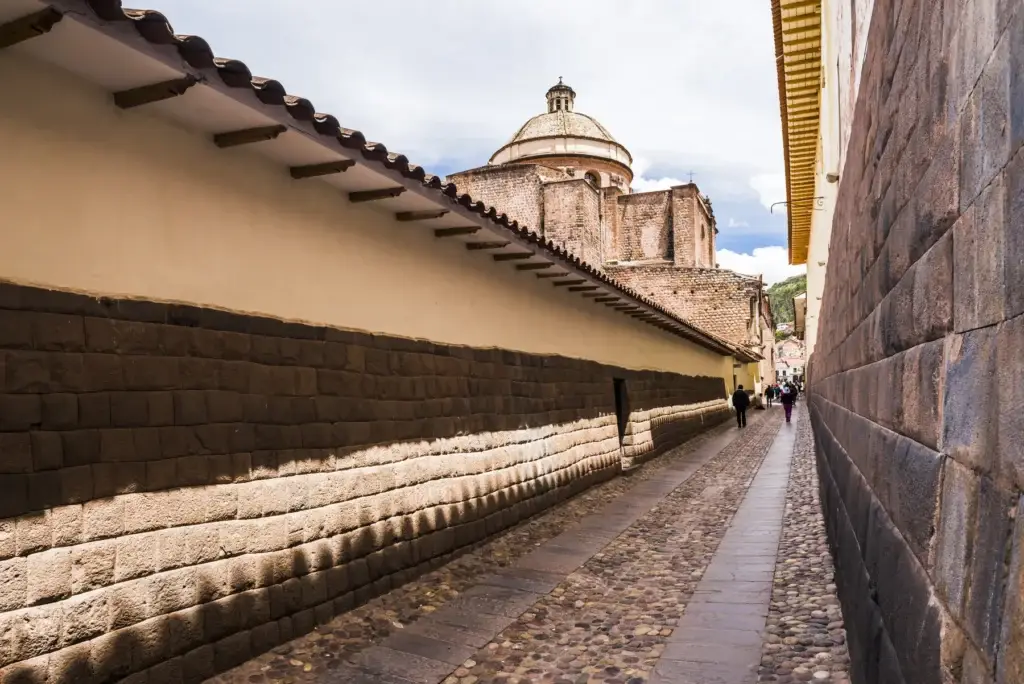 Exact Cusco streetscape where documented Inca masonry and later architecture can be interpreted
