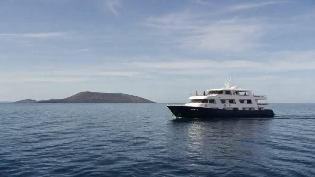 Licensed small expedition vessel in exact Galápagos waters or authorized anchorage