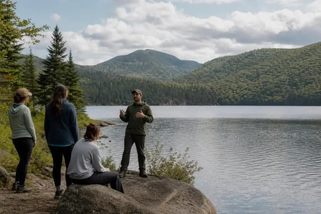 Park warden-naturalist activity, Lac Monroe rabaska or an interpretive trail in Parc national du Mont-Tremblant