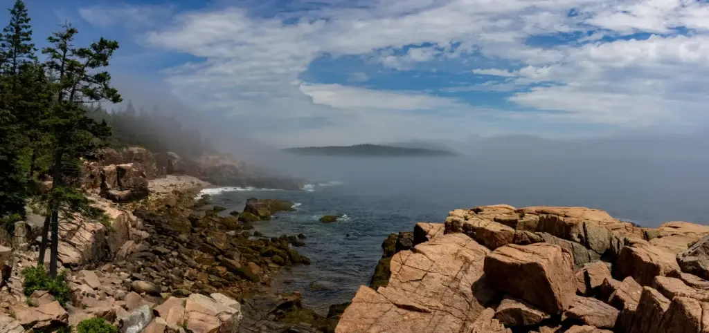 Acadia National Park granite coast with forest and Atlantic water
