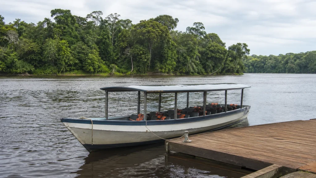 AI-generated editorial visualization of a safe road-to-boat transfer context for the Upper Suriname River.