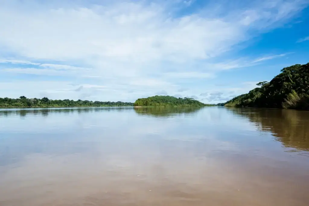 Image Of River In Peruvian Jungle. Amazon Forest During Day With Clouds. Open Nature Traveling In