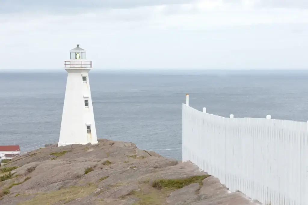 Cape Spear lighthouse and headland with visitors on designated trails only