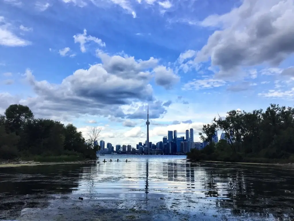 Ward's Island, Centre Island or a Toronto Islands path with lake and city context