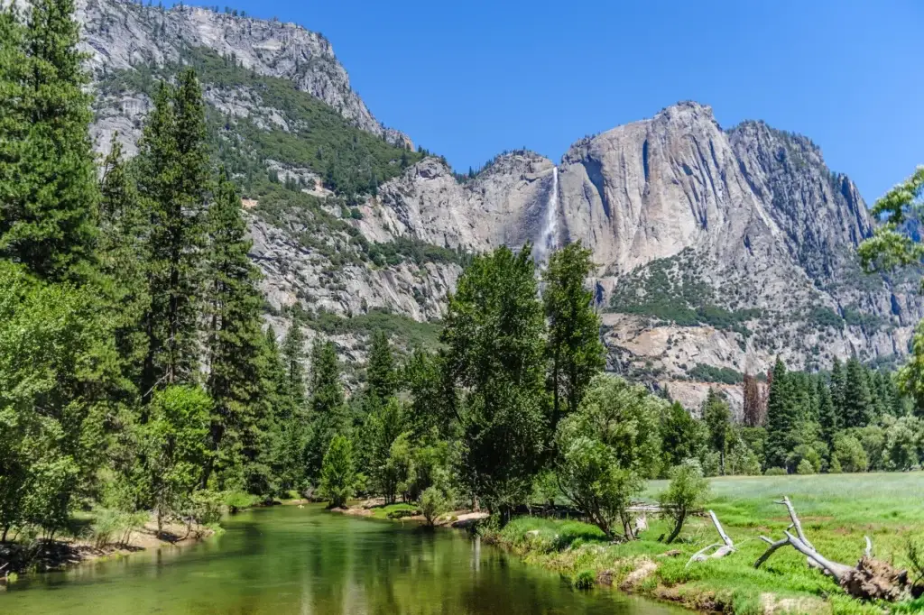 Yosemite Valley granite walls, meadow and water in one coherent frame
