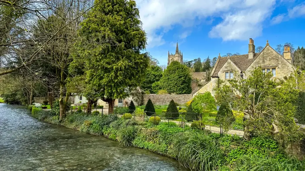 River and stone buildings at Castle Combe in the Cotswolds.