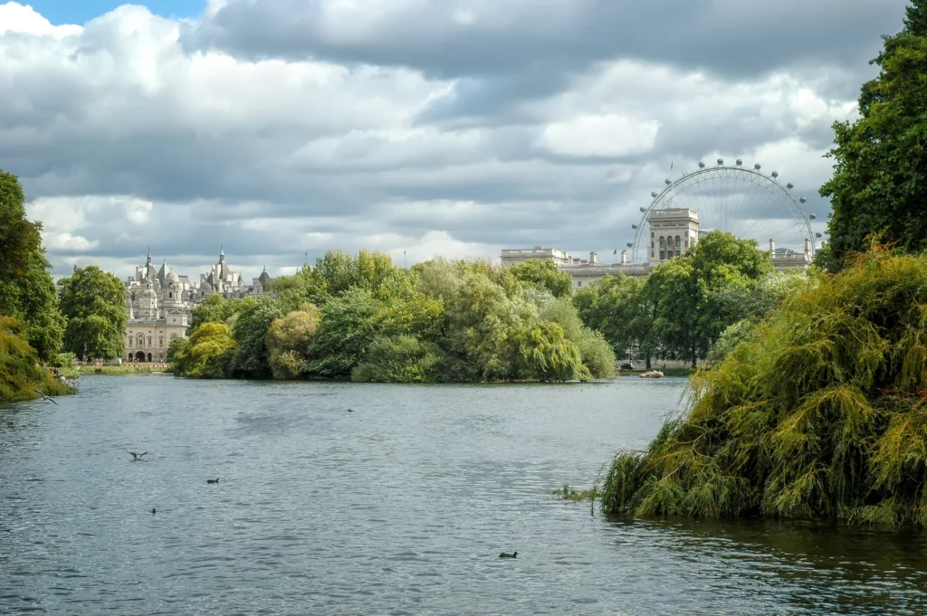 The lake in St James's Park, with the London skyline beyond.