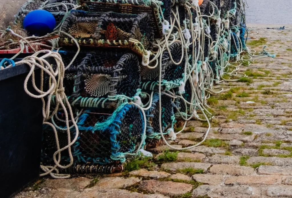 Illustrative fishing nets and traps at a harbor, not a documented Roundstone location.