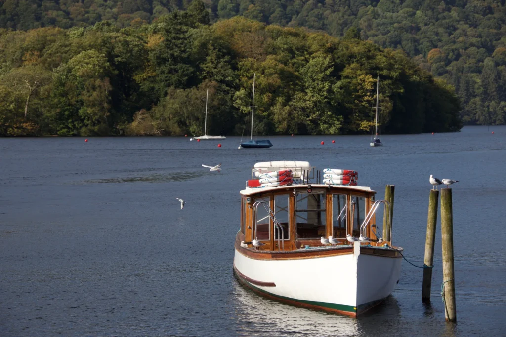A boat moored on Lake Windermere; lake context for a sailing, not a promise of a particular vessel or operator.