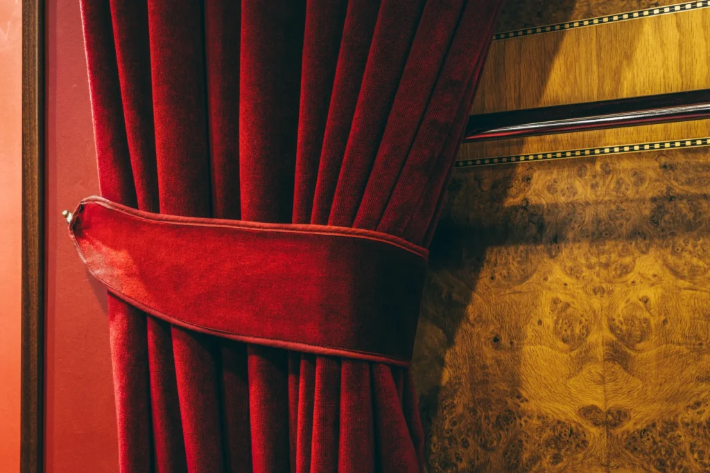 Illustrative theatre curtain, not the interior of Pitlochry Festival Theatre.