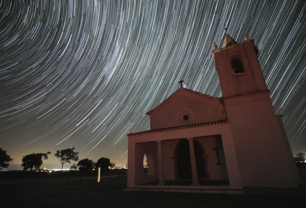Long-exposure star trails photographed in Portugal.