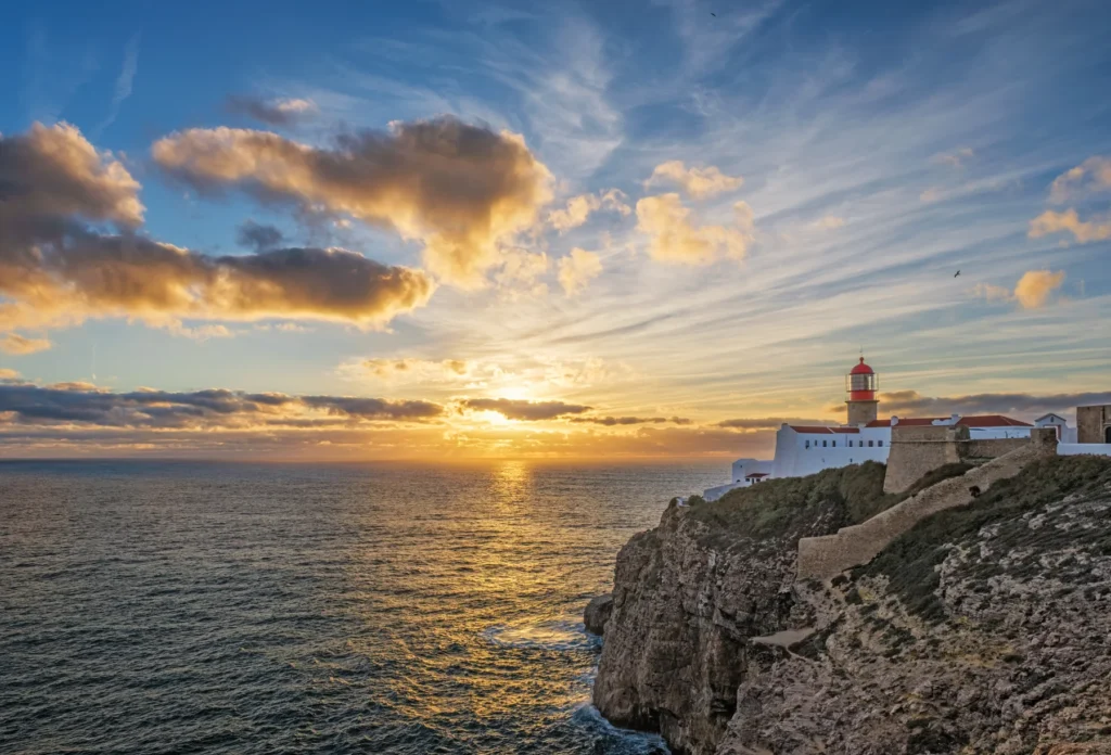 Cabo de São Vicente lighthouse above Atlantic cliffs.