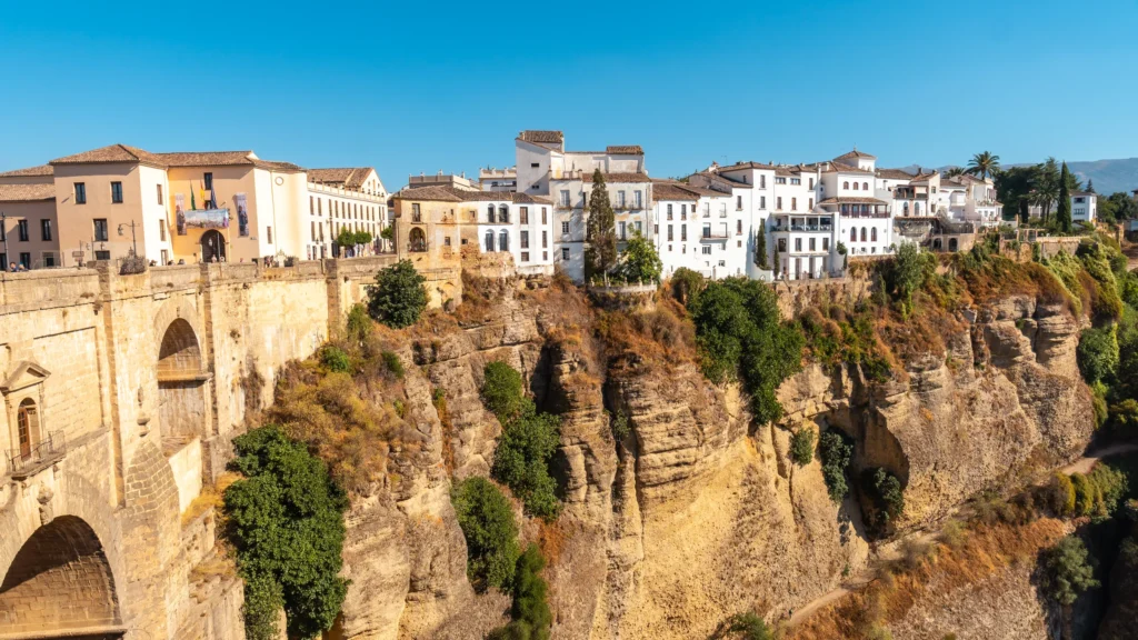 Ronda buildings and Puente Nuevo above the gorge.