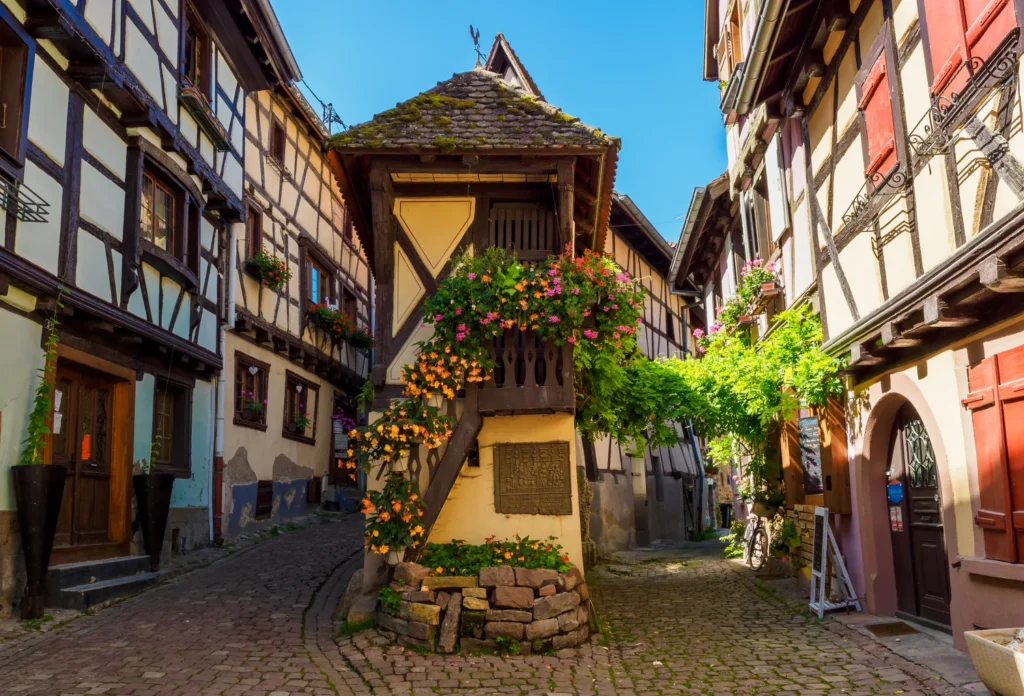 Traditional houses on a street in Eguisheim, France.