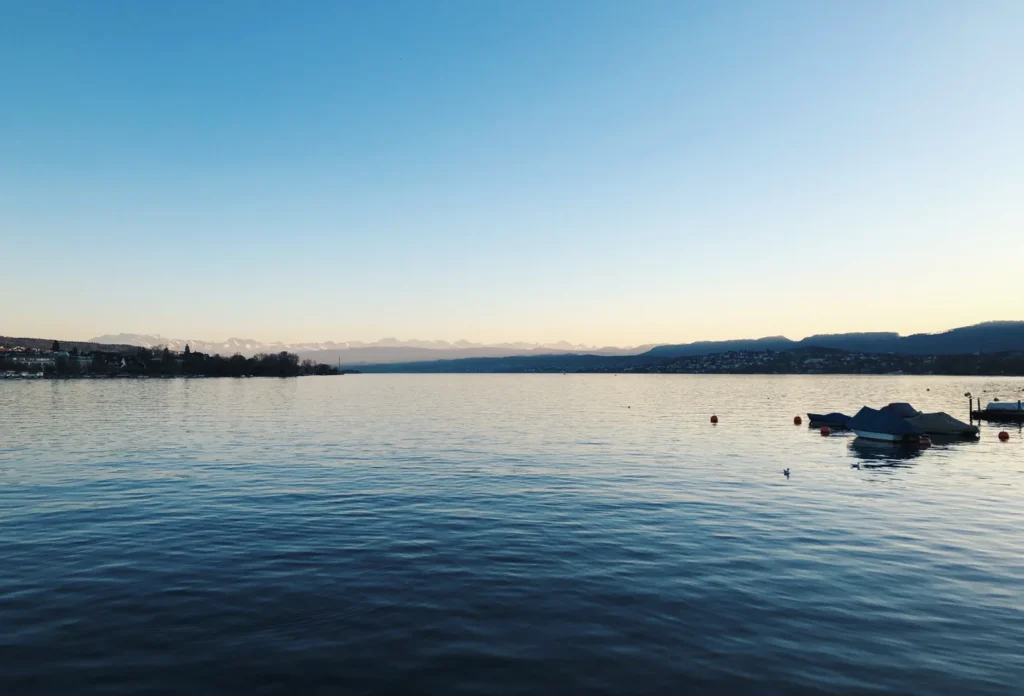 Zürich waterfront at sunset. No specific Seefeld address is represented.