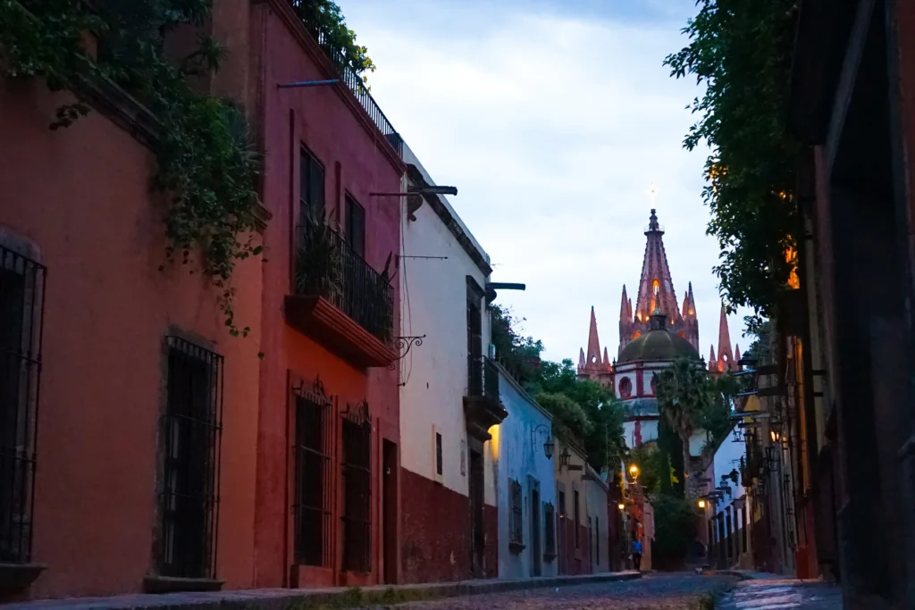 Historic Street Leading to Spired Church at Dusk