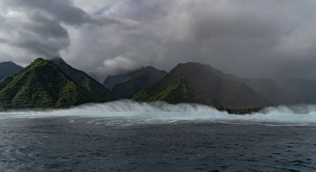 Mountains and Ocean with Large Waves Crashing
