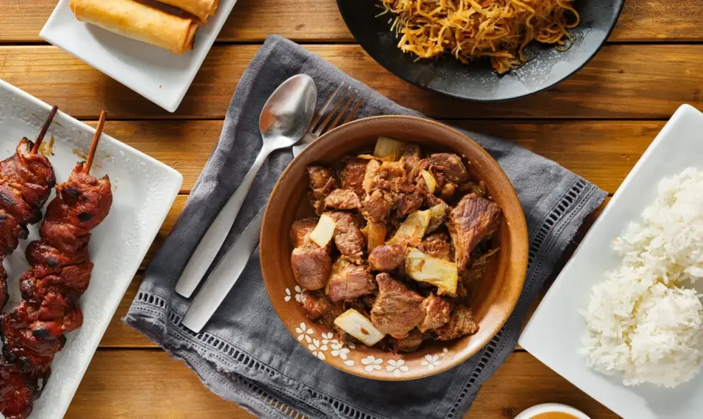 Filipino cuisine with rice and skewers