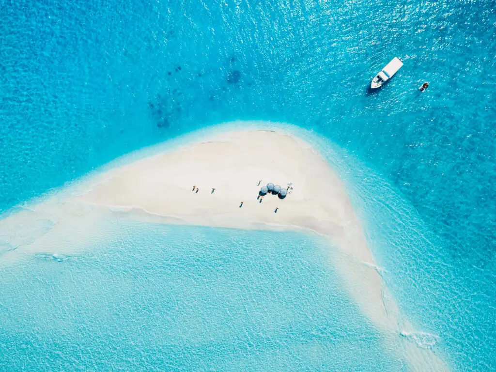 Private yacht near a pale sandbank in the Maldives