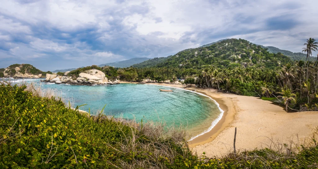 Cabo San Juan beach and forested hills in Tayrona National Natural Park, Colombia.
