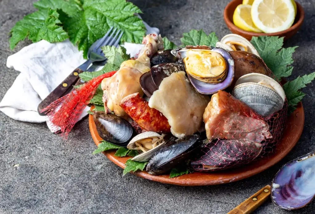 A curanto-style plate of shellfish, chicken and sausage.
