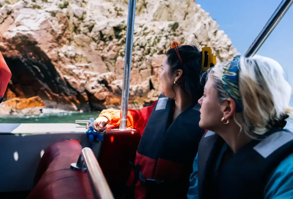 Friends on a boat near the Ballestas Islands, Peru.