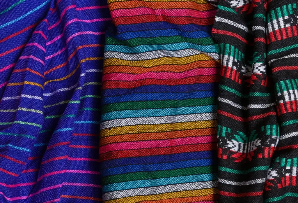Colorful Mexican tablecloth textiles.